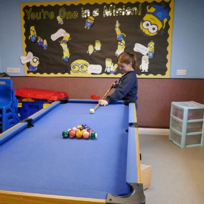Another pupil playing pool