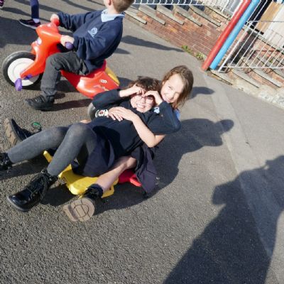 Two pupils on a flat trike