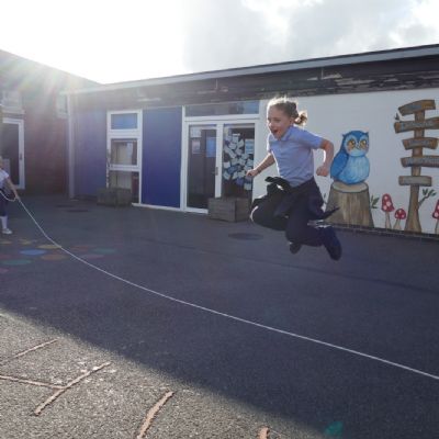 One Pupil skipping in mid air